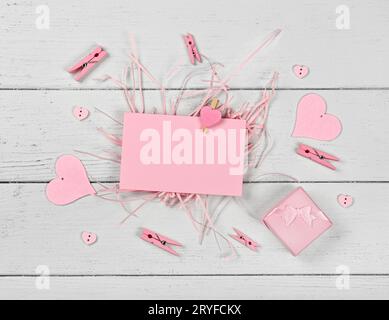 Pink Valentine paper card note on white wood Stock Photo