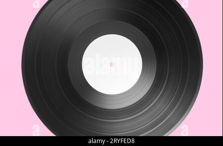 Vinyl record on pink background. White label Mock up Stock Photo