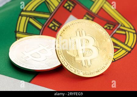 Bitcoin cryptocurrency coins on national flag of Portugal. Crypto law regulation concept Stock Photo