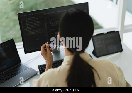 Developer programmer working to checking code on monitor while programming to developing website. Stock Photo