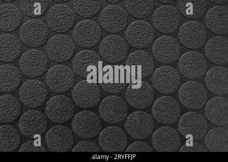 Black textured vinyl background. Dot pattern. Full frame Stock Photo