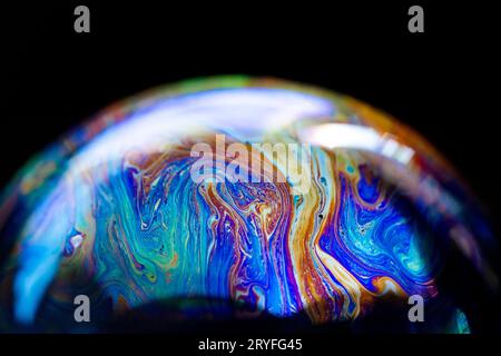 Abstract multicolored pattern, chaotic texture inside of the soap bubble, closeup Stock Photo