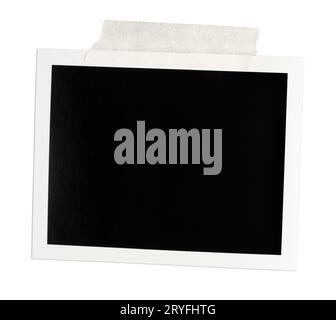 Blank Vintage instant photo frame with brown tape isolated on white background Stock Photo
