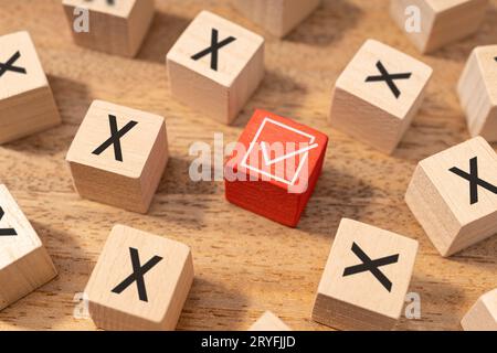 Right or good decision making concept. Check mark symbol and wrong or cross icon on wooden cubes Stock Photo