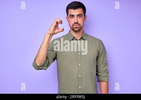 letter C spelling by man's hand in American Sign Language (ASL) on blue background, closeup portrait, confident Caucasian guy demonstrating the letter Stock Photo