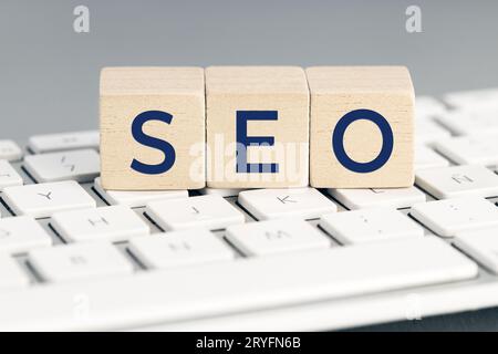 SEO word on wooden blocks on computer keyboard. Search Engine optimization concept Stock Photo