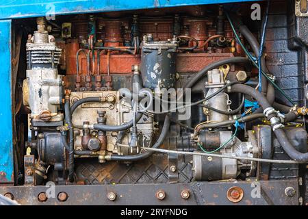 Opened diesel engine compartment of old belarussian farm tractor Stock Photo