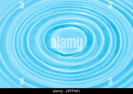 Blue Water background texture with Drop circles on water surface Stock Photo