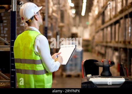 Manager man worker doing stocktaking of product management on shelves ...