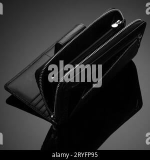 Closeup of a fashionable leather wallet on a dark background Stock Photo