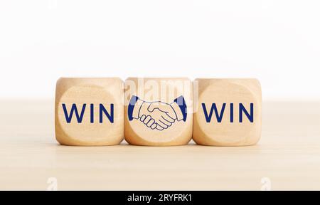 Win Win concept. Text and handshake Icon on wooden blocks. Copy space Stock Photo