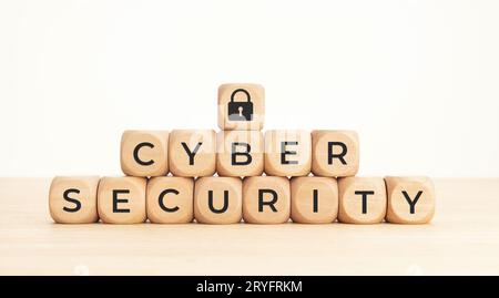 Cybersecurity data protection concept. Text and lock pad icon on wooden blocks Stock Photo