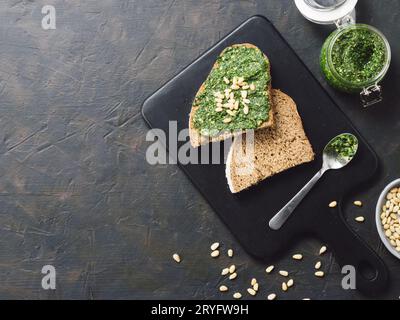 Whole grain rye bread with fresh pesto Stock Photo