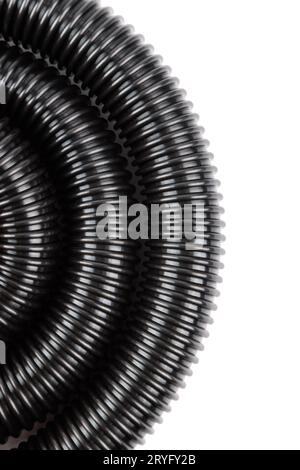 Black plastic corrugated vacuum cleaner hose on white background Stock Photo