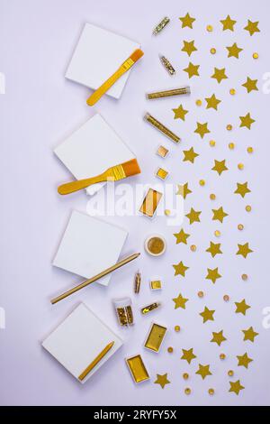 White blank canvas frame mock up. Frame border made of shining glitter and gold paint for creative projects. Fairy abstract glowing glitter on a white Stock Photo