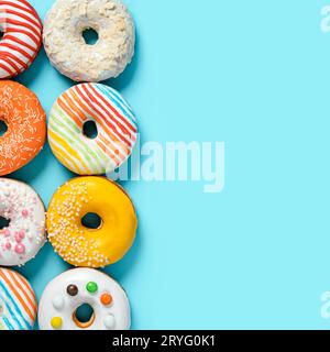 Glazed donuts on colorful background, top view Stock Photo