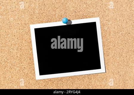 Blank Vintage instant photo frame pinned on corkboard. Template Stock Photo