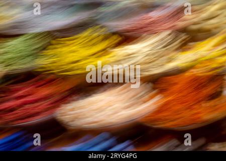 Abstract creative photo made via intentional camera movement. Various colorful spices in the market, motion blur. Stock Photo