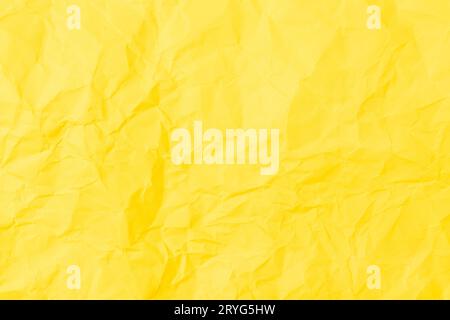 Yellow crumpled paper background texture. Full frame Stock Photo