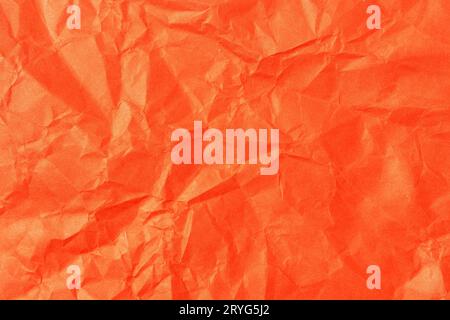 Red crumpled paper background texture. Full frame Stock Photo