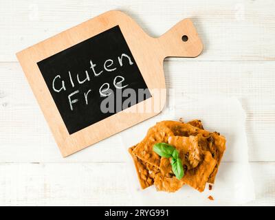Gluten-free crispbreads on white wooden bg Stock Photo