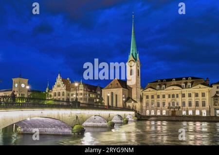 Famous Fraumunster church and Munsterbrucke bridge over river