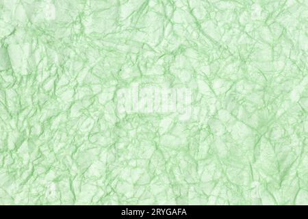 Crumpled paper abstract background texture. Green color. Full frame Stock Photo