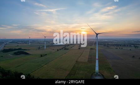 Beautiful wind turbine in the countryside in the time of sunset background. Wind Turbines Windmill Power Farm. Carratraca on the Stock Photo