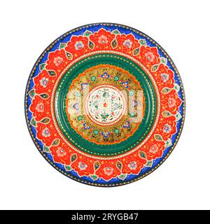 A top view of an oriental ceramic plate with a floral pattern on a white background, Uzbekistan Stock Photo