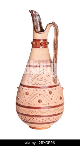 A vintage decorated ceramic jug isolated on a white background Stock Photo