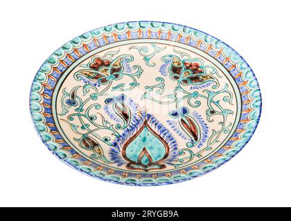 A vintage oriental ceramic plate isolated on a white background Stock Photo