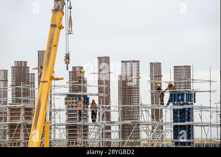 A workers with special equipment in a construction site make formwork Stock Photo