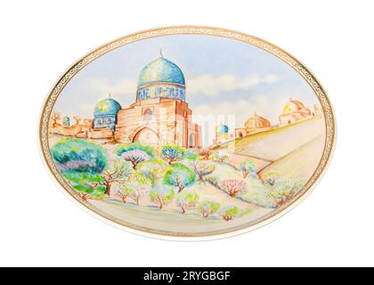 A vintage oriental ceramic plate isolated on a white background Stock Photo