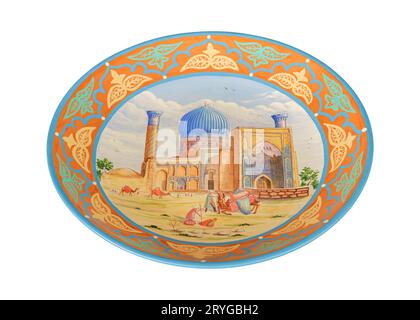 A vintage oriental ceramic plate isolated on a white background Stock Photo