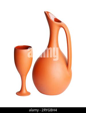 A brown clay jug with a cup isolated on a white background Stock Photo