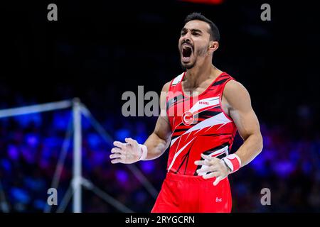 Ferhat Arican, of Turkey, reacts after winning the bronze medal for the ...