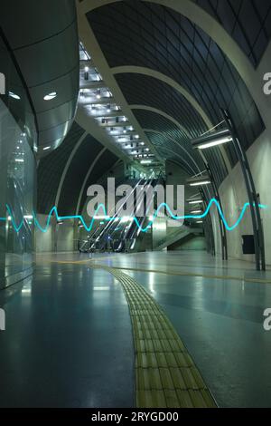 ECG pulse light in the futuristic subway station and an escalator in Heumarkt Cologne, Germany Stock Photo