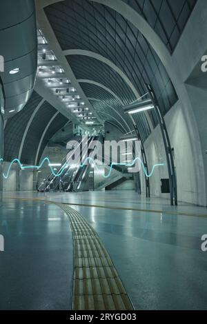 ECG pulse light in the futuristic subway station and an escalator in Heumarkt Cologne, Germany Stock Photo
