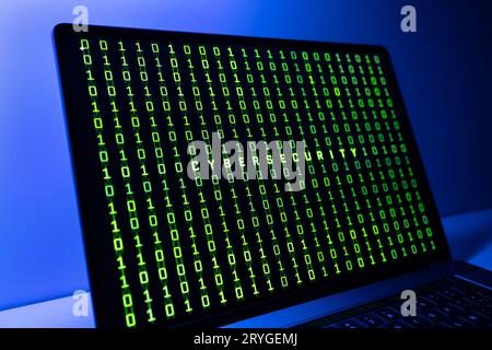 Cybersecurity concept. Laptop screen with cibersecurity word and binary code background Stock Photo