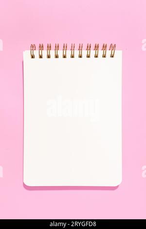 Blank white paper notebook Isolated on pink background. Template mock up Stock Photo