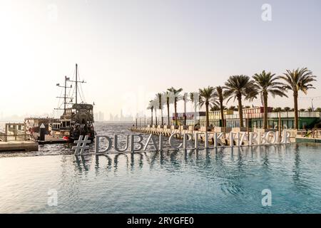 Dubai, UAE - November 13, 2022: City skyline at the sunset on a hazy day, view from Creek Harbour Stock Photo