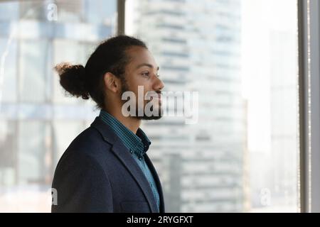 Head shot profile of successful dreamy African American businessman Stock Photo