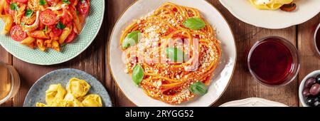 Pasta panorama. Assortment of Italian pastas, with spaghetti Bolognese etc Stock Photo