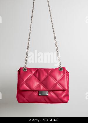 Quilted crossbody bag in Viva Magenta red color 2023 year Stock Photo