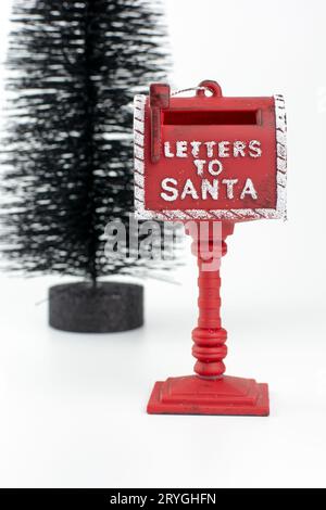 LETTERS TO SANTA red Christmas holiday mailbox on white background. Stock Photo