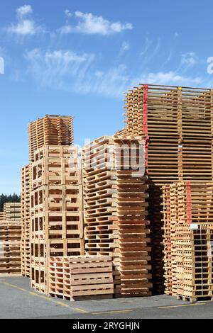 Stacked wooden pallets or skids Stock Photo