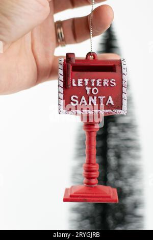LETTERS TO SANTA red Christmas holiday mailbox on white background. Stock Photo