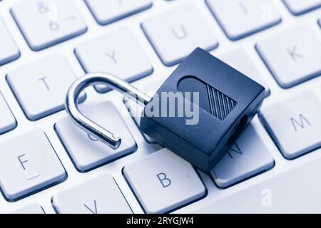 Computer and network Security Vulnerability concept. Open padlock on keyboard Stock Photo