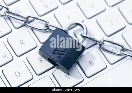 Computer Security and data privacy concept. Chain and padlock on keyboard Stock Photo