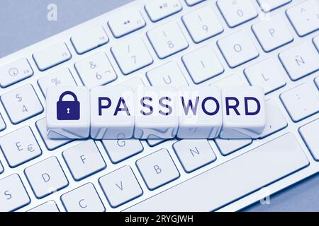 Password word and Closed padlock icon on cube blocks on computer keyboard Stock Photo